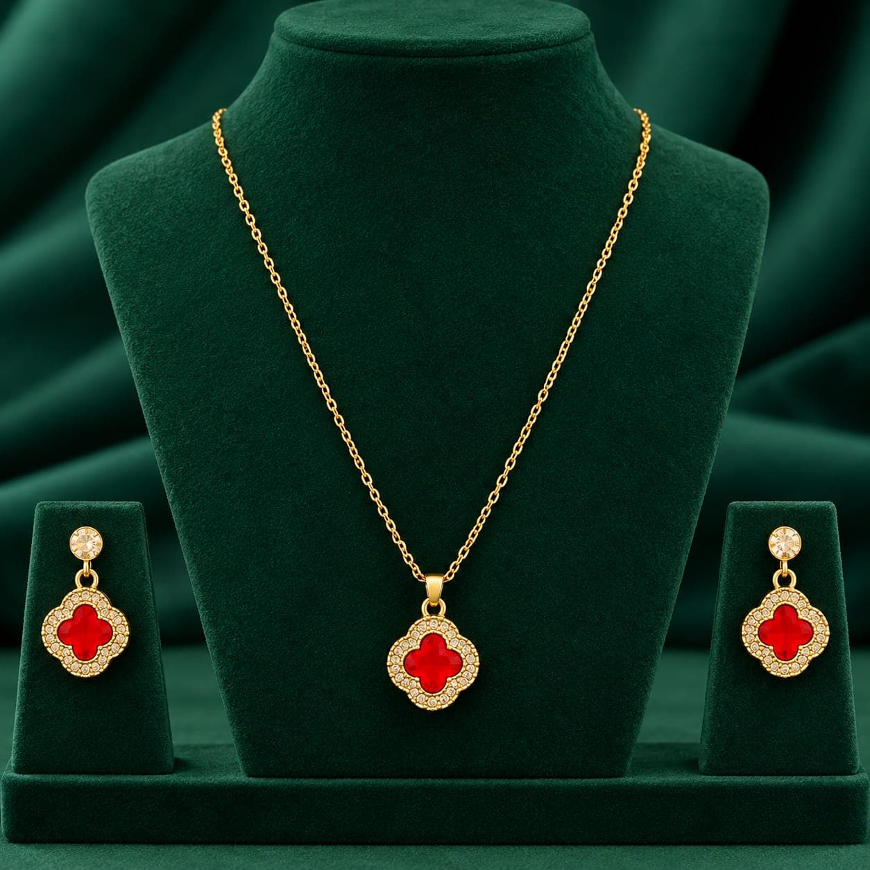Necklace and matching earrings on a green display